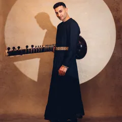 A full-length portrait from the 'Sitar Sorcerer' shoot, playing with light and shadow. The visual presentation is a key part of my artistic expression.