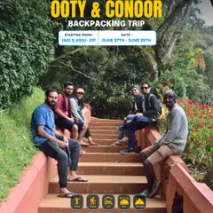 A group of friends relaxing on the steps in a garden during our Ooty & Coonoor backpacking trip.