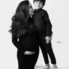 A sweet black and white portrait of a mother and her son. The way they look at each other is full of love and a special bond.