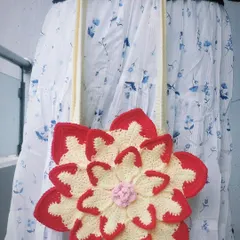 This is my custom-made Lotus Bag, a vibrant and playful shoulder bag that brings a pop of color to any outfit. The layered petal design is a great example of how I can turn a simple accessory into a piece of wearable art.