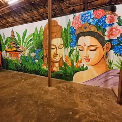 The right side of the Bali mural, focusing on the portrait of a woman adorned with a crown of blue and red flowers, adding a touch of elegance to the scene.