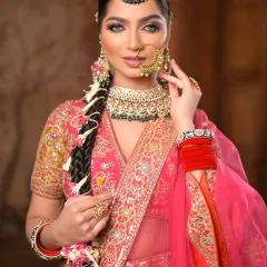 This close-up captures a true fairytale look. The sharp winged eyes, flawless dewy glow, and nude lips create a striking and regal bridal statement.