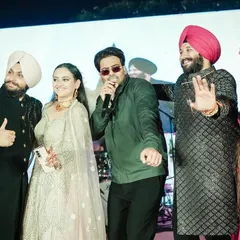 The couple enjoying a live performance by singer Mankirt Aulakh at their wedding celebration.