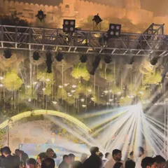 Another perspective of the magical winter wedding at the fort. The light show was designed to highlight both the stage and the incredible architecture.