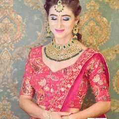 A reception look created for my client from France. The focus is on a striking blue eyeshadow that contrasts beautifully with her pink lehenga and emerald green jewellery set.