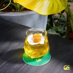 The Mysore Patkini cocktail, a sparkling and refreshing drink that looks like sunshine in a glass.