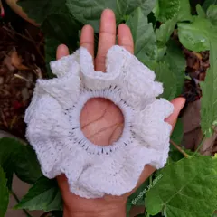 This large, fluffy white crochet scrunchie is super soft and gentle on your hair. It's perfect for a classic, clean look.
