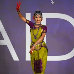 A senior student showcasing a beautiful mudra and serene expression. Her performance was recognized with a 2nd place award in her category.