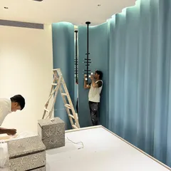 Our team carefully installing the custom light fixture. This is what our hands-on approach looks like.
