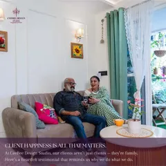 A photo of a happy client couple relaxing on their sofa, with the text "Client happiness is all that matters."