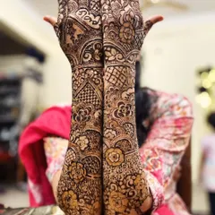 Mehendi for my brother's wedding celebration. This intricate design combines floral elements with geometric patterns, covering the hands and arms beautifully.