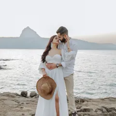 By the serene lakeside at sunset, a quiet promise is shared. This intimate pre-wedding portrait captures the gentle, unspoken bond that forms the foundation of a lifetime together.