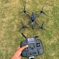 A point of view shot showing my FPV drone and the controller in my hand. This is my connection to the sky, the tool I use to capture the action.