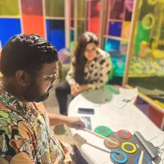 We encourage exploring a mix of traditional and modern instruments. This session shows a trainee experimenting with an electronic drum pad, discovering new ways to introduce rhythm and beats to children.