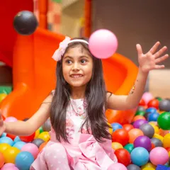 This is what pure joy looks like! A candid moment of laughter in our giant ball pit is what my parties are all about.