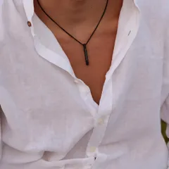 This black bar pendant, engraved with coordinates, offers a subtle and modern way to carry a special place with you. The black finish provides a unique, understated look.