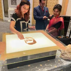 Here I am, focused on the details of a portrait for the Jay Shree Tea event. It's always a joy when guests come up to watch the process up close.