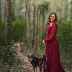 A walk in the woods with a faithful companion. This portrait has a timeless, storybook quality, with the tall trees creating a beautiful, serene backdrop. It’s a celebration of the quiet bond shared on countless walks together.