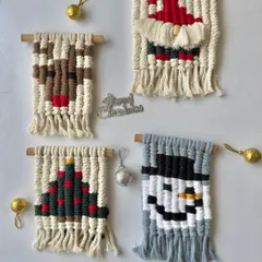 My collection of mini macrame Christmas wall hangings, featuring a reindeer, Santa, Christmas tree, and a snowman. These are adorable as ornaments or small decor pieces.