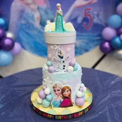 Let it go? Never! This magical two-tier Frozen cake features Elsa, Anna, and Olaf, with a special light-up rotating topper for Kiansha's 5th birthday.