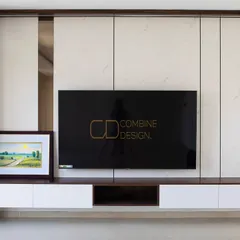 A floating TV unit isn’t just for looks; it creates visual lightness. Here, I paired it with marble-finish panels and a backlit display cabinet to merge function with finesse.