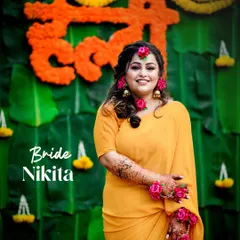 A lovely portrait of the bride at her Haldi ceremony, set against a traditional marigold and banana leaf backdrop. We ensure the decor and theme of your event are beautifully documented.