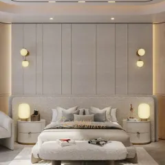 This bedroom is a study in soft minimalism, with its curved, textured headboard and matching bench. The wall paneling and integrated lighting create a seamless and sophisticated backdrop.