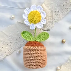 Our full-size potted crochet daisy, a charming piece of decor that brings the freshness of a garden indoors, forever.