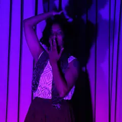 An expressive still from my "Soulo 12" performance. The dramatic lighting highlights the emotion and storytelling conveyed through facial expression and body language.