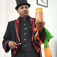 Getting ready to perform an illusion with a magic canister and vibrant silks. These classic props are a staple of my close-up magic act and never fail to create a sense of mystery.