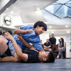 This is Brazilian Jiu-Jitsu in action. Here, two of our young warriors learn to use technique and leverage, not just size, to control a situation. It's a physical chess match that builds critical thinking under pressure.
