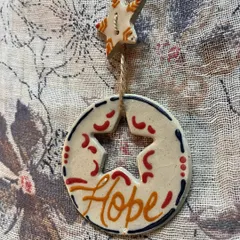 My 'Hope' affirmation ornament, designed with a star cut-out. It's a reminder to hold onto hope during the festive season and beyond.