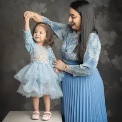 A sweet dance between mother and daughter. These candid moments of joy are what make a family photoshoot so special.