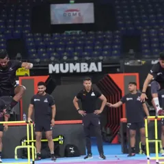 Explosive power in action. Athletes perform synchronized hurdle jumps during a pre-match warm-up, activating their nervous systems and preparing their bodies for high-intensity movements.