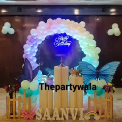 The same butterfly setup seen at night, with the "Happy Birthday" neon sign and balloon arch beautifully illuminated. It shows how my decorations can look amazing day or night.