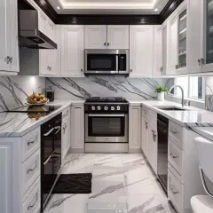 A compact yet powerful U-shaped kitchen design featuring classic white shaker-style cabinets contrasted with black hardware and appliances. We used a dramatic black and white veined quartz for both the countertop and floor, creating a cohesive and high-end look.