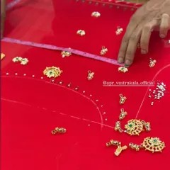 The process of creating a jewellery concept blouse. Here you can see individual stone and kundan pieces being carefully arranged and measured on the fabric.