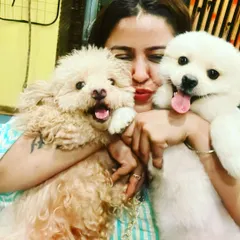 For me, it's not just a business, it's a life full of love. I get to cuddle these adorable babies all day. This is me with two of my happy guests, who are all smiles after a fun day of play.