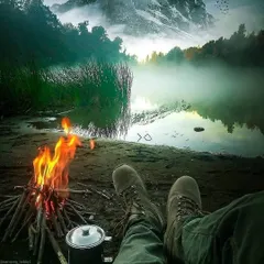 A quiet moment of reflection by the fire, with the misty lake and mountains as your backdrop. This is the kind of peaceful solitude I seek to provide, a chance to simply sit and soak in the immense beauty of the outdoors.
