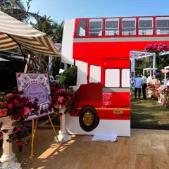 To capture the spirit of Mumbai for a Haldi carnival, we brought in iconic elements like this life-sized double-decker bus prop. It served as a fantastic photo opportunity and instantly set a fun, energetic tone for the event.