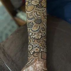 The design extending down the arm, showing how the different elements connect to create a full sleeve.