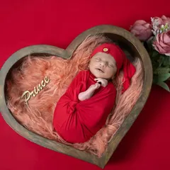 Another angle of our little prince, showing his peaceful smile. We always take our time to wait for these magical, fleeting expressions during our newborn photoshoots.