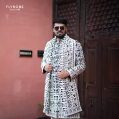 Make a statement at your Sangeet or cocktail party with a modern Indo-western outfit. This black and white embroidered jacket is a perfect example of how I blend traditional craft with contemporary style.