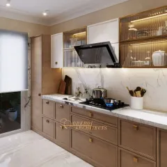This kitchen design uses a warmer palette, with beige cabinetry and a white marble countertop. The fluted glass upper cabinets add a touch of vintage charm.