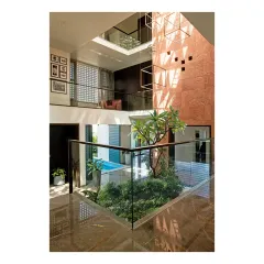 The Notan Home features a central courtyard with a swimming pool, visible from multiple levels. This design brings light, air, and the calming presence of water into the very heart of the house.