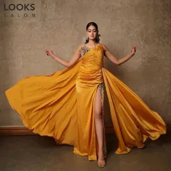 The full view of this stunning party ensemble. The makeup was designed to complement the dramatic yellow gown, with a focus on flawless skin and defined eyes that stand out.