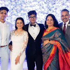 A beautiful family portrait from a Catholic wedding. The bride's makeup is soft, natural, and elegant, perfectly suited for her white lace gown.