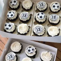 A set of custom cupcakes for an "Official Teenager," with half featuring a soccer ball and the other half a "13" topper.