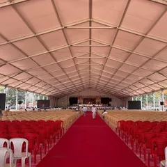 This image shows the sheer size of one of our German hanger tents before the event begins. The vast, pillar-less interior can be configured with thousands of chairs for political rallies, corporate conferences, or other large-scale gatherings.