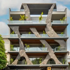 Inspired by the fluidity of natural wave forms, this residential facade in Gurgaon showcases my passion for sculptural architecture. The design uses concrete grooving and a stone finish to create a dynamic, organic structure that is both a home and a piece of art.